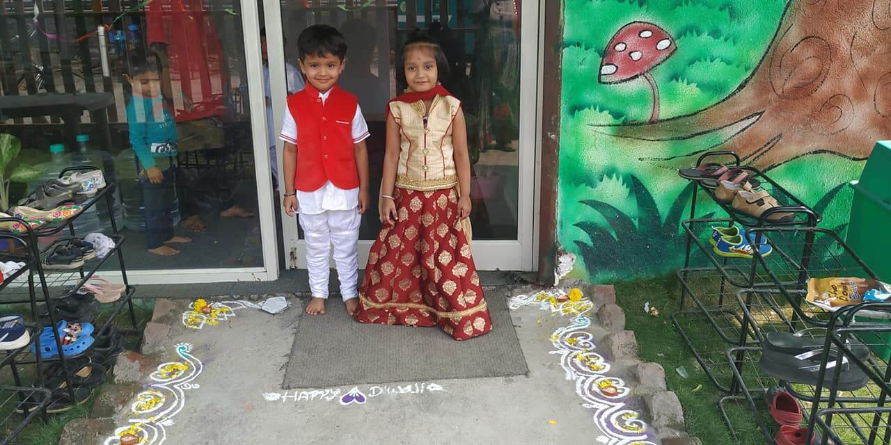 Students and teachers at Dr. Kamna's Gurukool Preschool celebrating Diwali with traditional attire, crafts, and decorations.