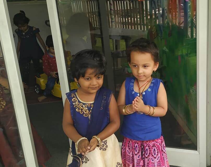 Students and teachers at Dr. Kamna's Gurukool Preschool celebrating Diwali with traditional attire, crafts, and decorations.