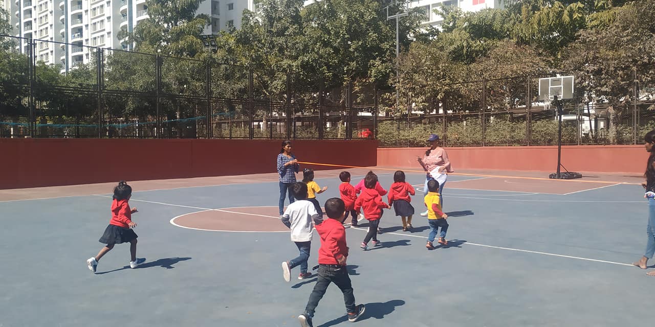 Students engaging in various physical activities at Dr. Kamna's Gurukool Preschool.