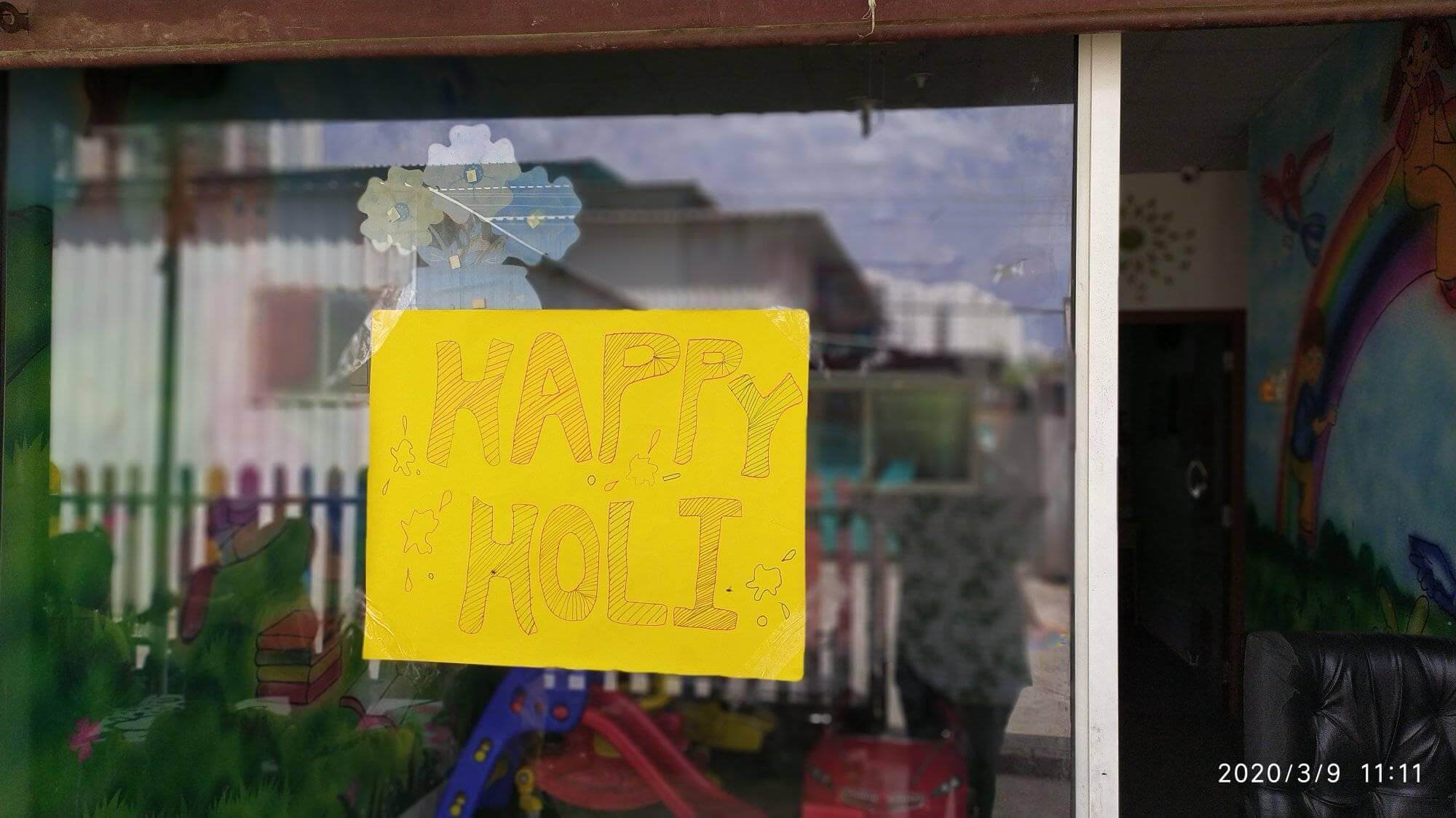 Students and teachers at Dr. Kamna's Gurukool Preschool celebrating Holi with vibrant colors and traditional activities.